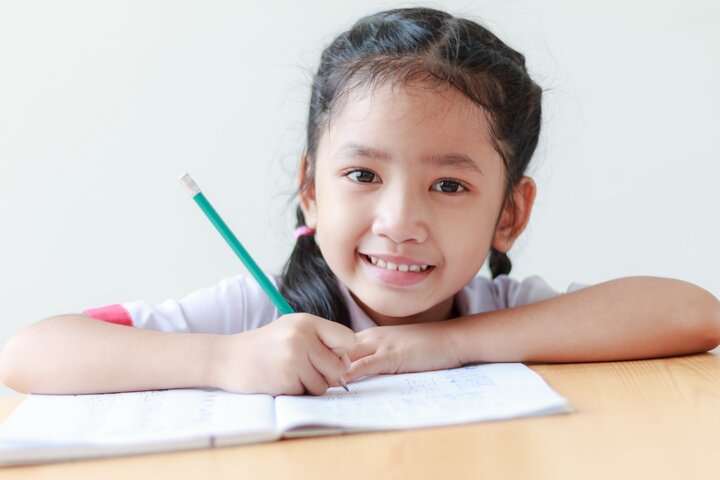 Girl writing in a Journal